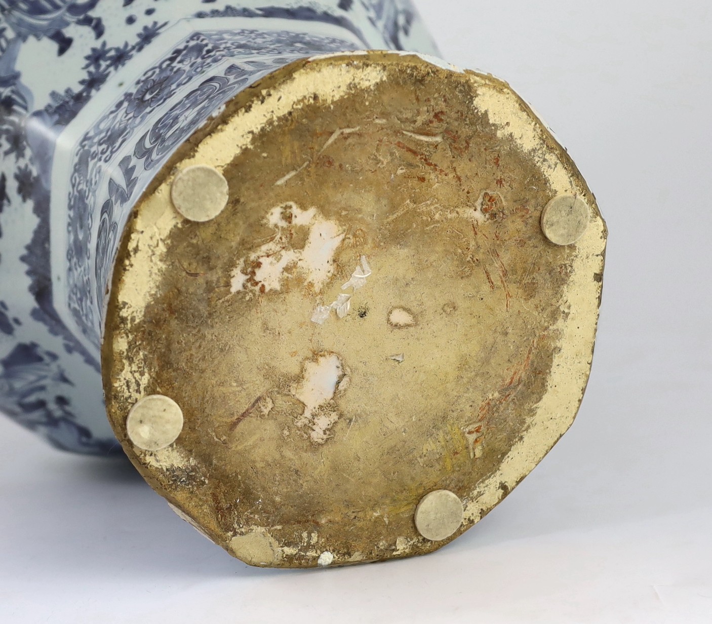 A massive Delft blue and white inverted baluster vase and cover, c.1700, 57.5cm high, neck and cover restored